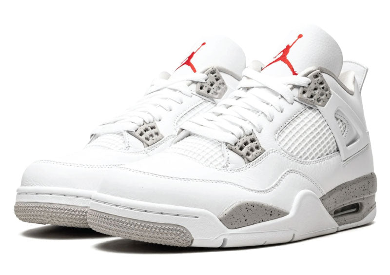 Air Jordan 4 Retro White Oreo basketball shoe with a white upper, grey speckled eyelets, and red Jumpman logo on the tongue.